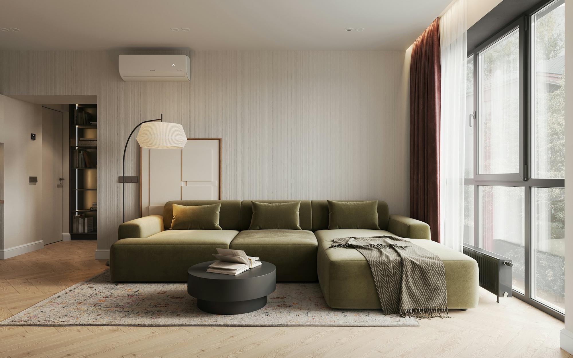 A styled living room with an olive sectional sofa