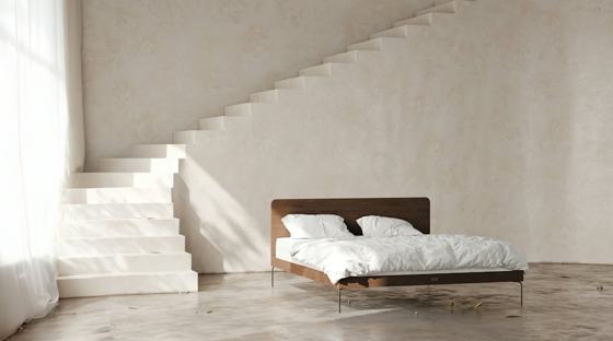 A bed sitting under a stair case next to a window