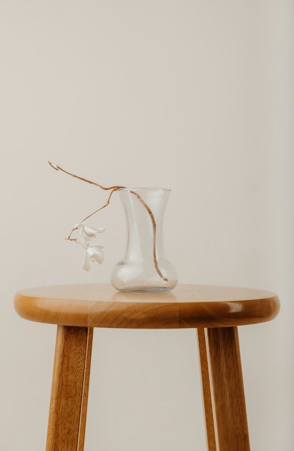 Clear glass vase on brown wooden table