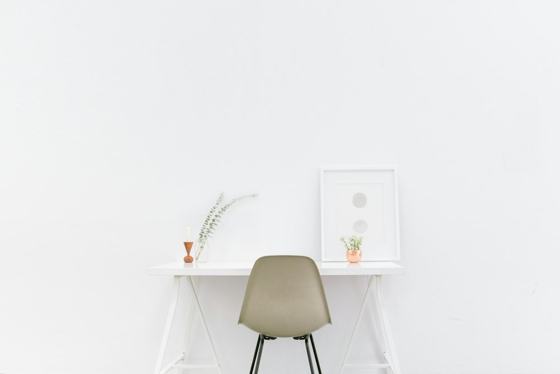 White wooden table near brown chair