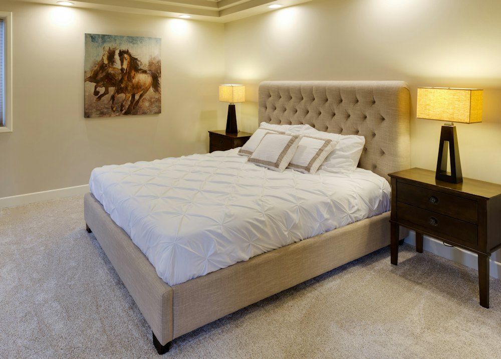 Beige bed with white mattress