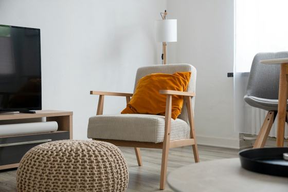 A living room with a couch, chair and television