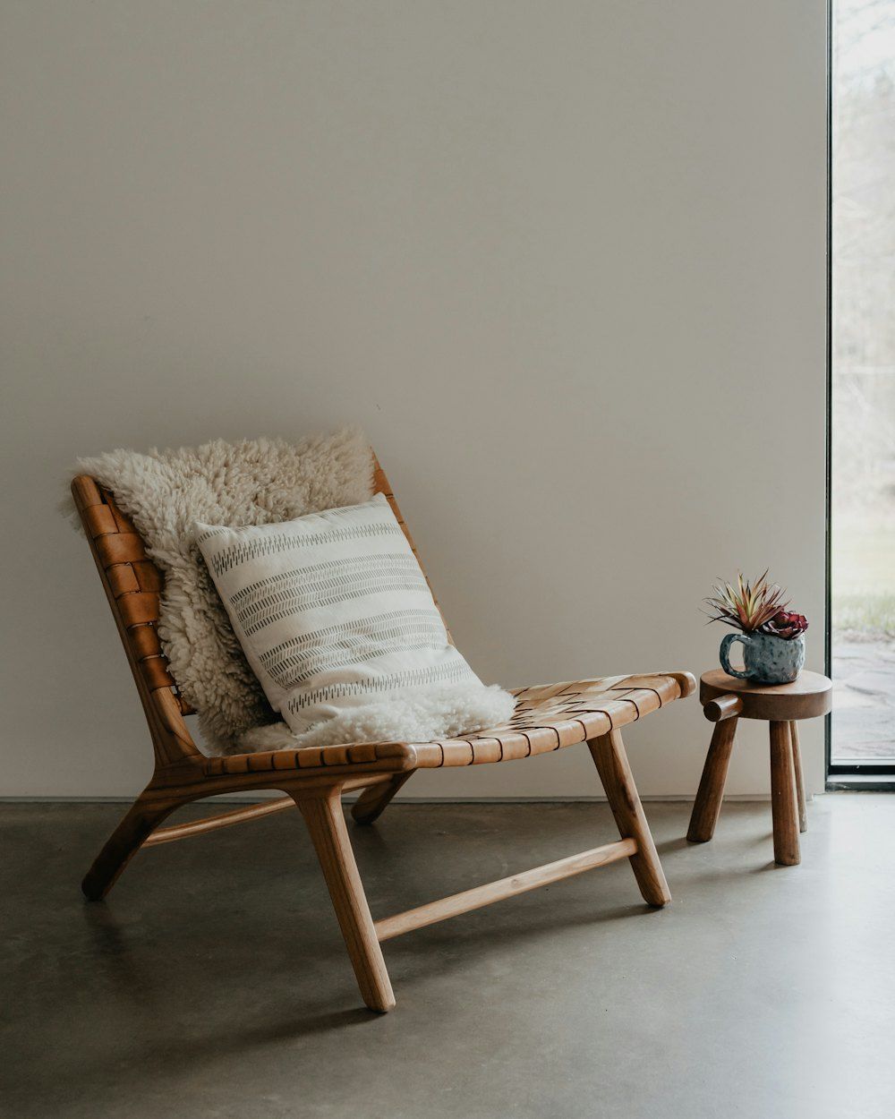 A chair and a small table in a room