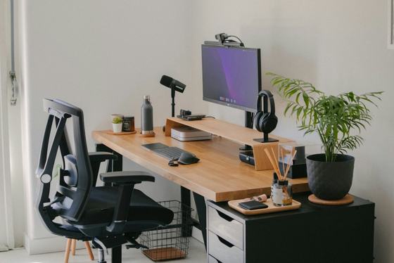 A desk with a computer and a chair