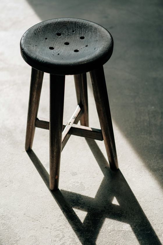 A stool on a concrete floor