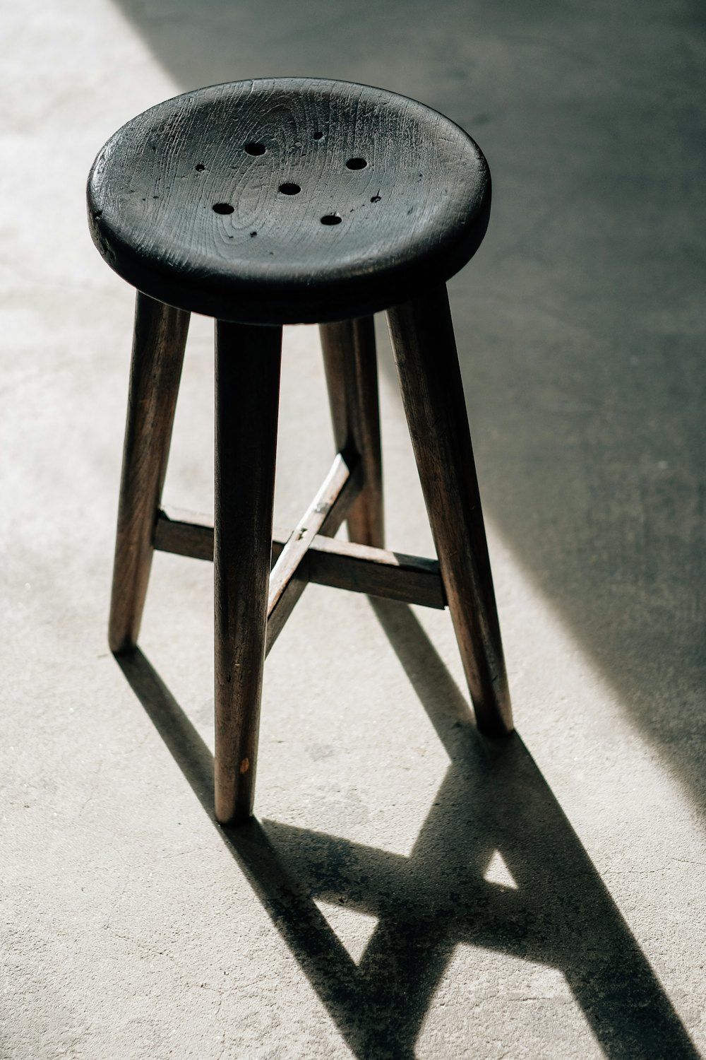 A stool on a concrete floor