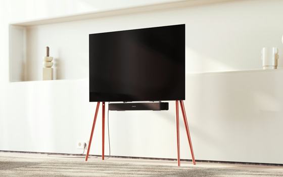 A flat screen tv sitting on top of a wooden stand