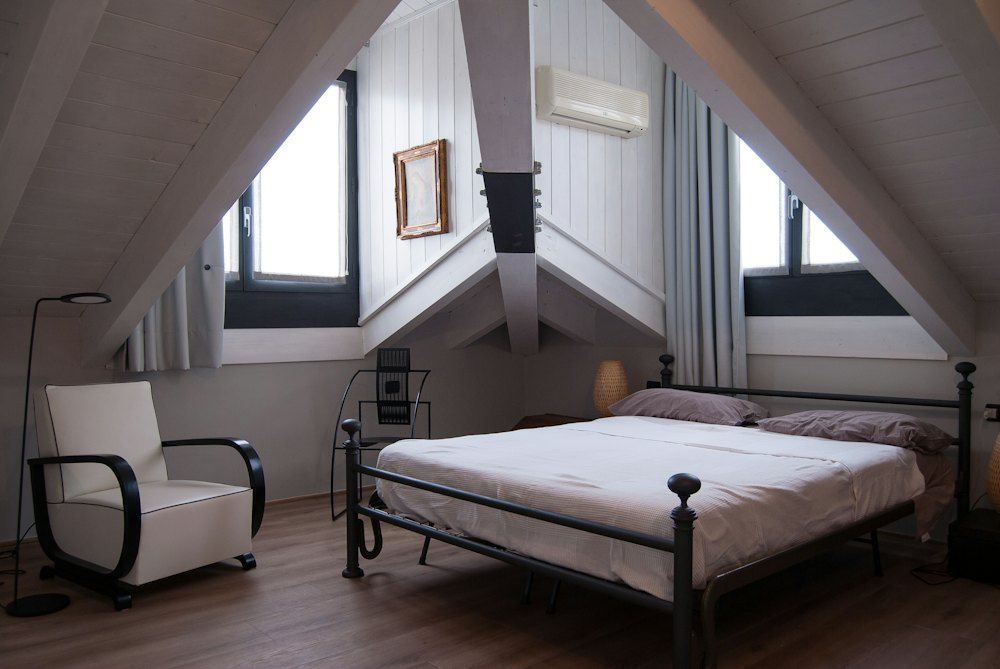 Black steel bed frame near window