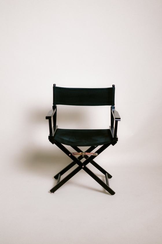 A black director's chair on a white background