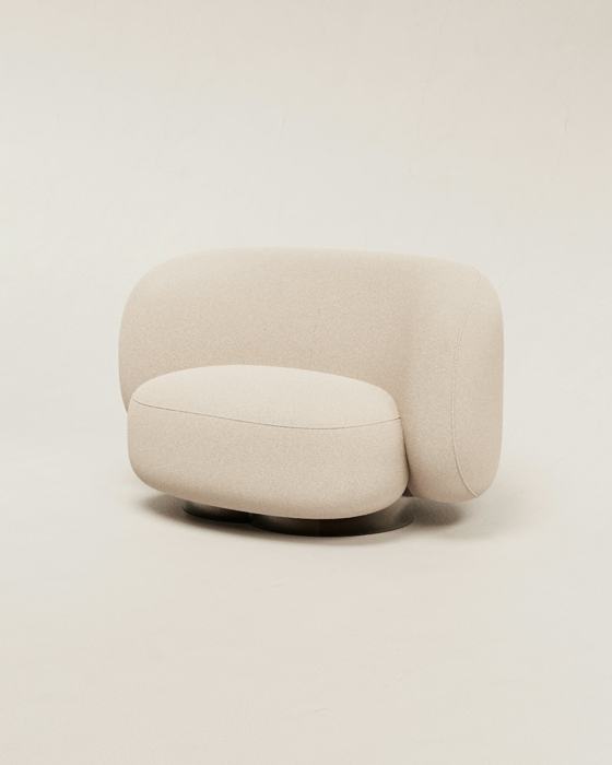 A white couch sitting on top of a white floor