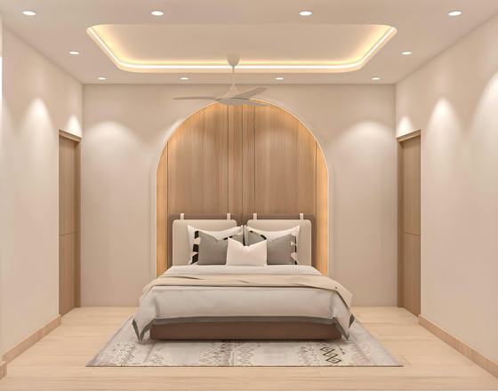 A modern bedroom with a stylish, neutral aesthetic