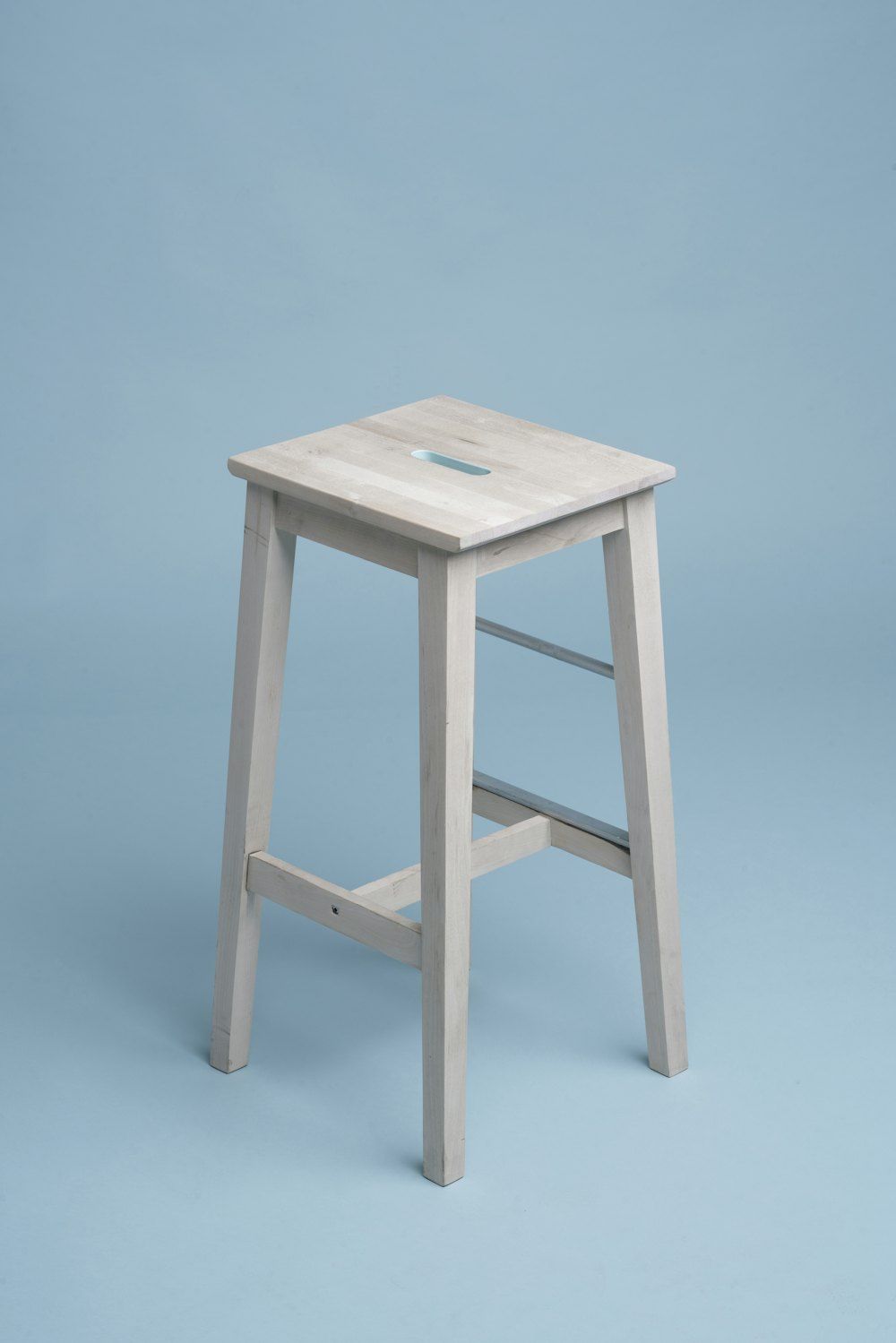Beige wooden bar stool