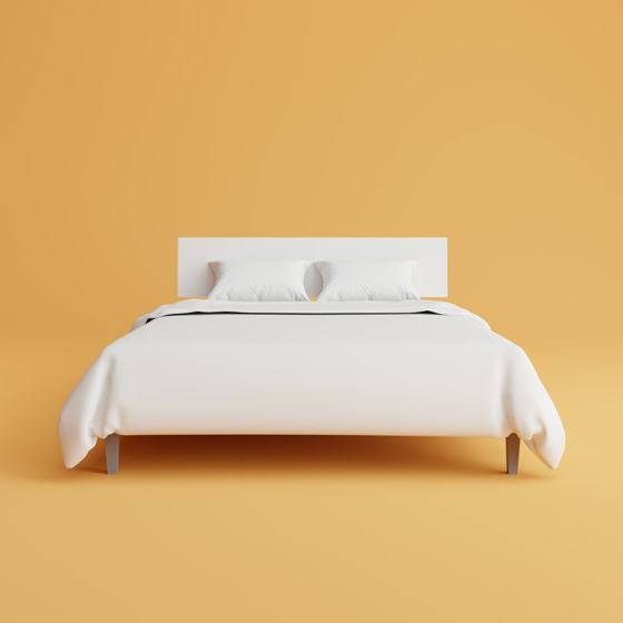 A bed with a white cover and pillows on top of it