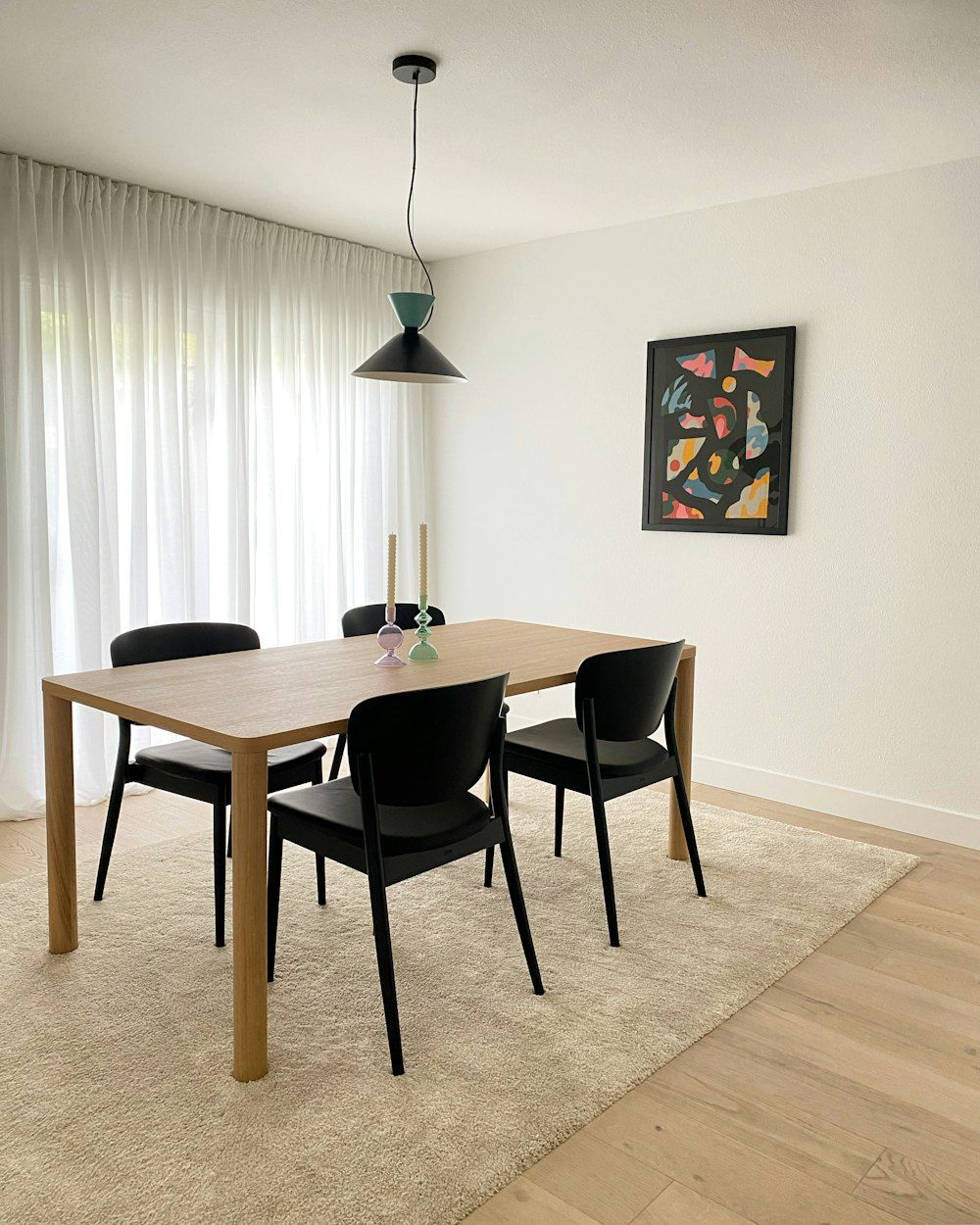 A dining room table with chairs