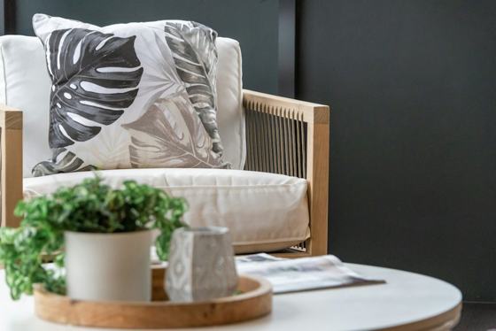 White throw pillow on white sofa chair