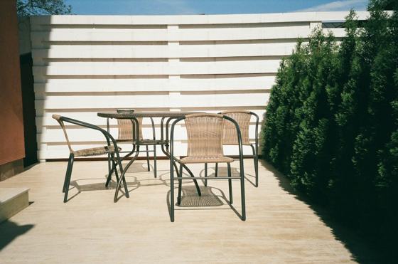 Black metal framed white wooden table and chairs