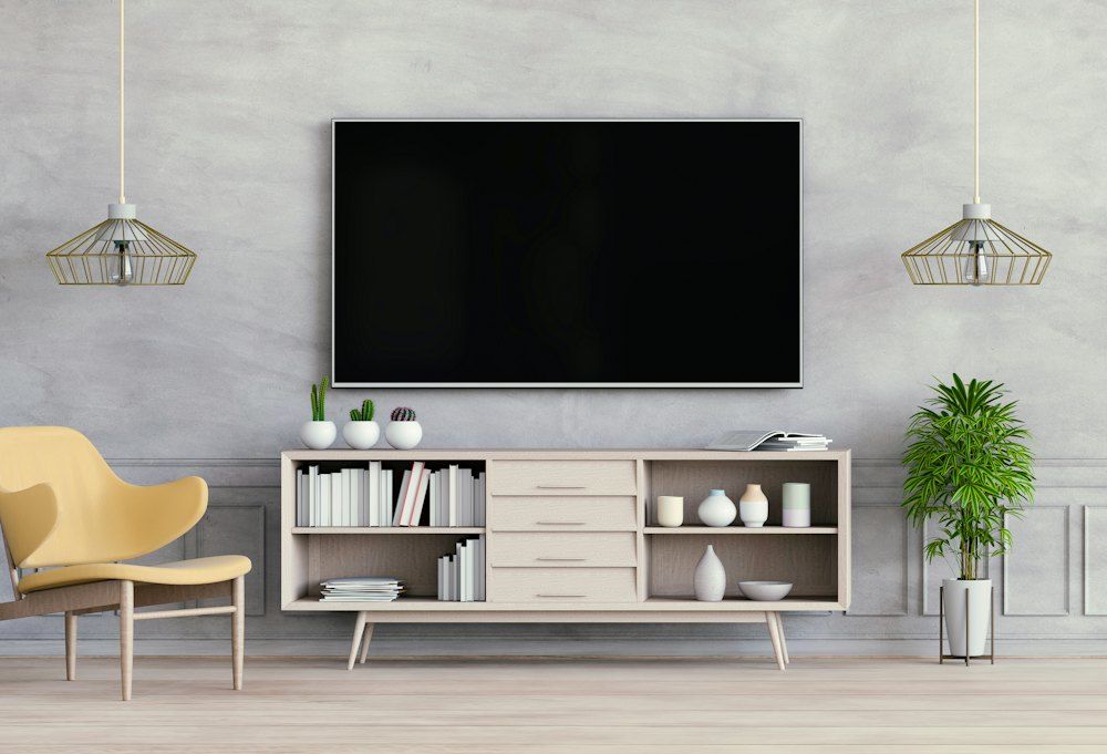 A room with a tv and shelves