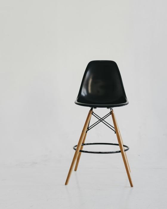 Black chair on white snow