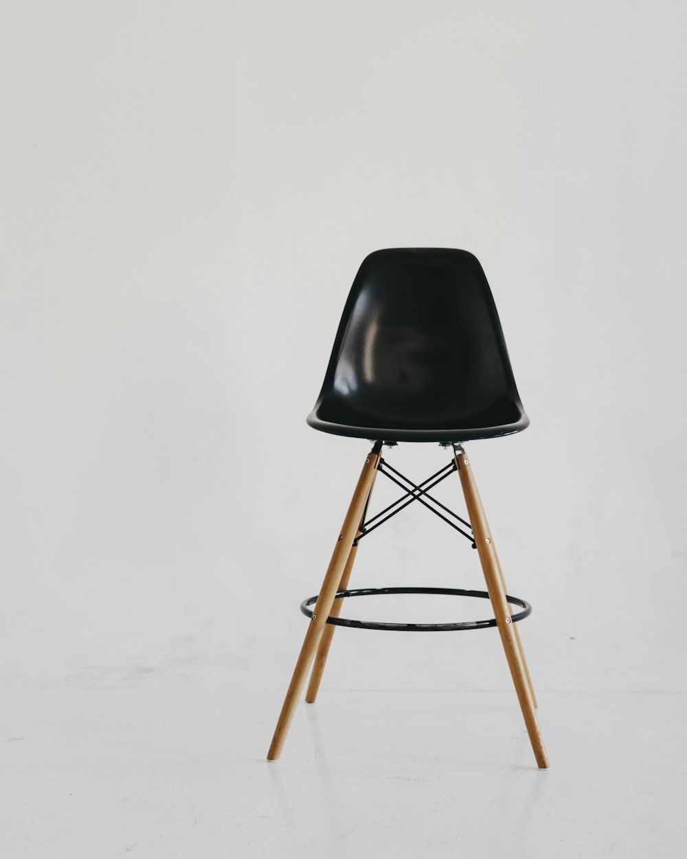 Black chair on white snow