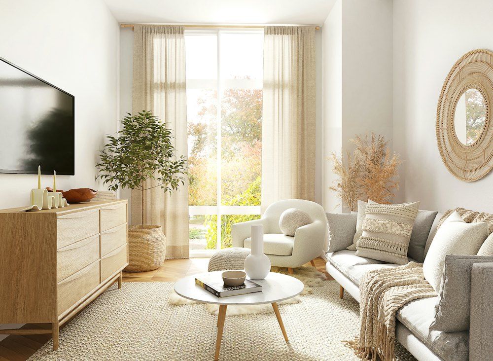 White and gray sofa chair near window