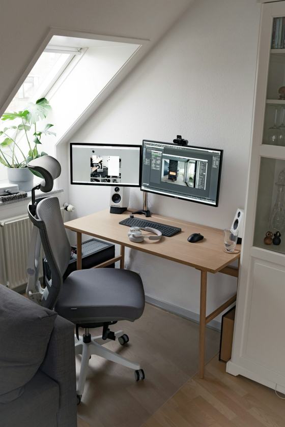 Black flat screen computer monitor on brown wooden desk