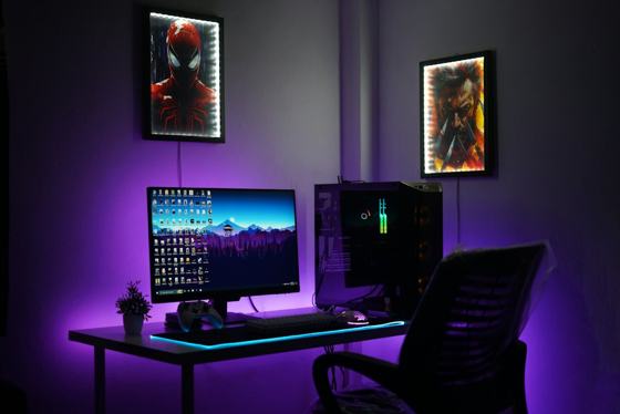 A computer desk with two monitors and a keyboard