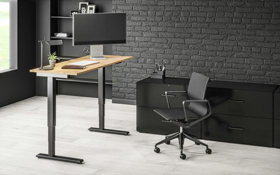 Black flat screen computer monitor on brown wooden desk