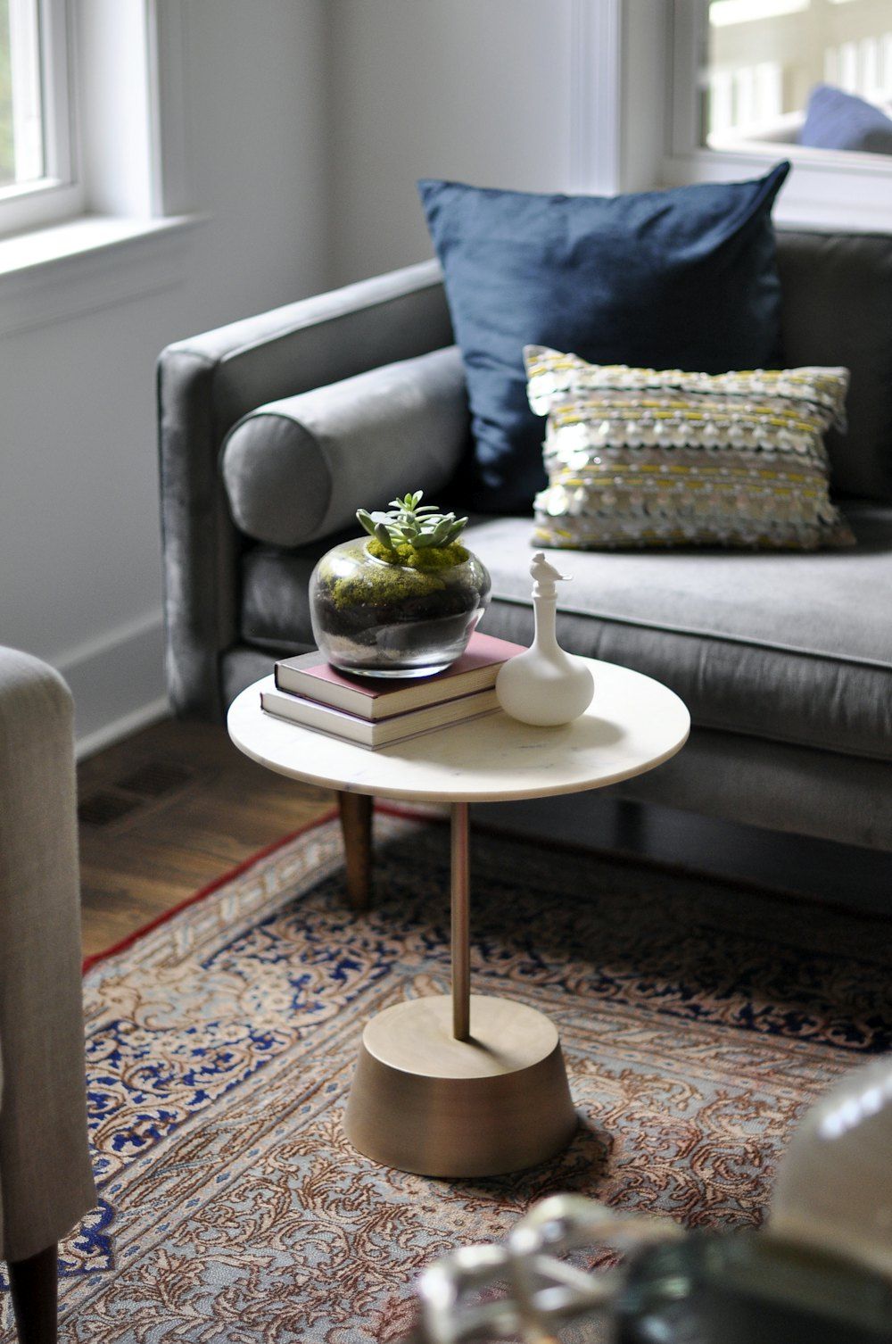 A living room with a couch and a table