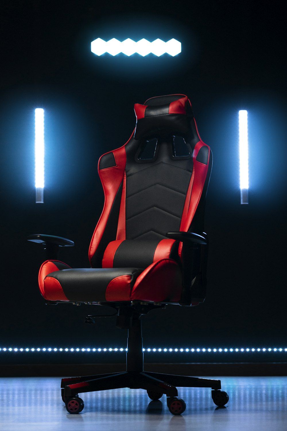 A red and black gaming chair with blue lights