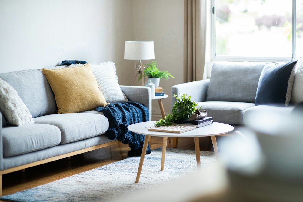A living room with a couch and a coffee table