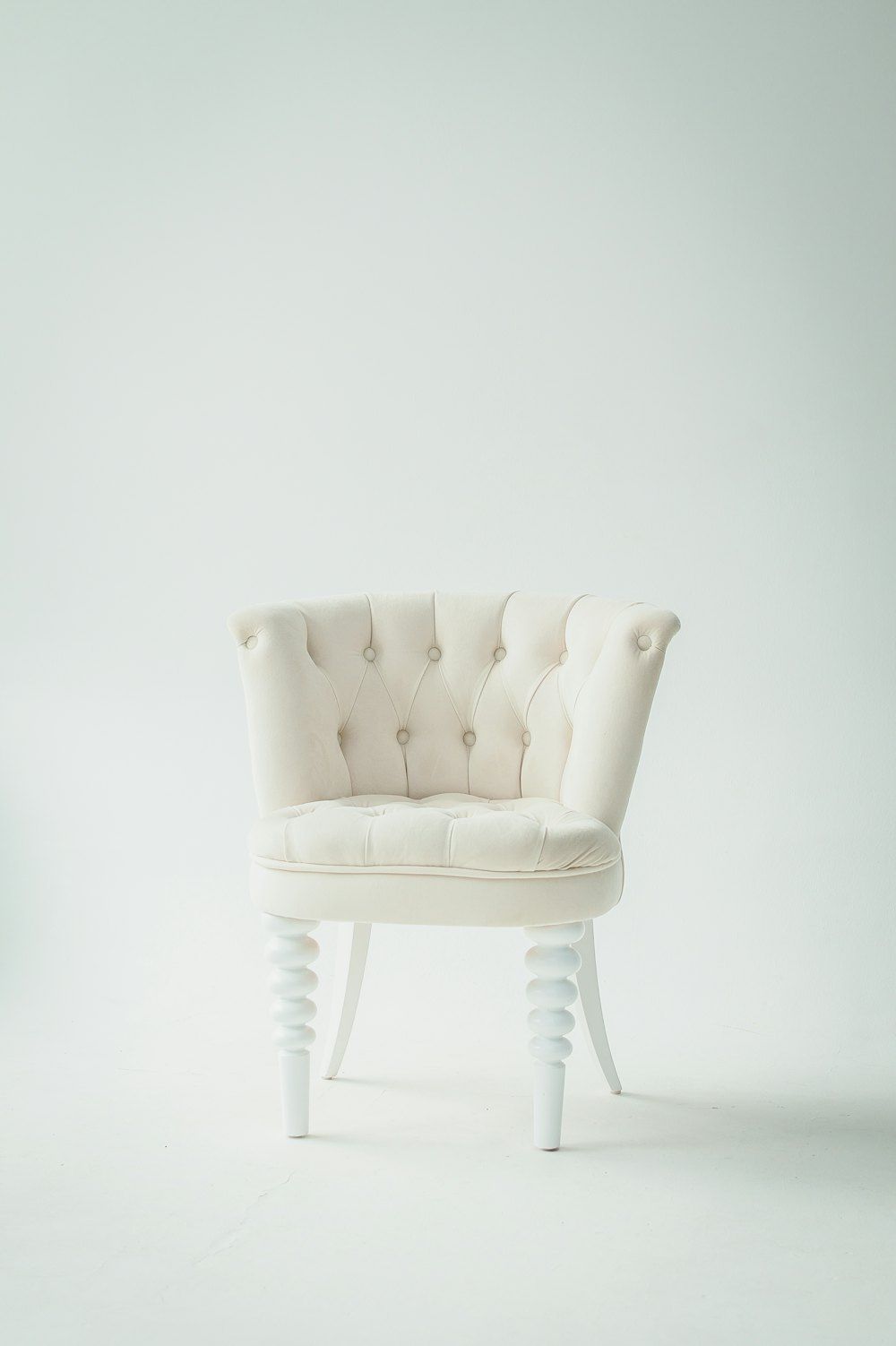 Tufted white leather sofa chair