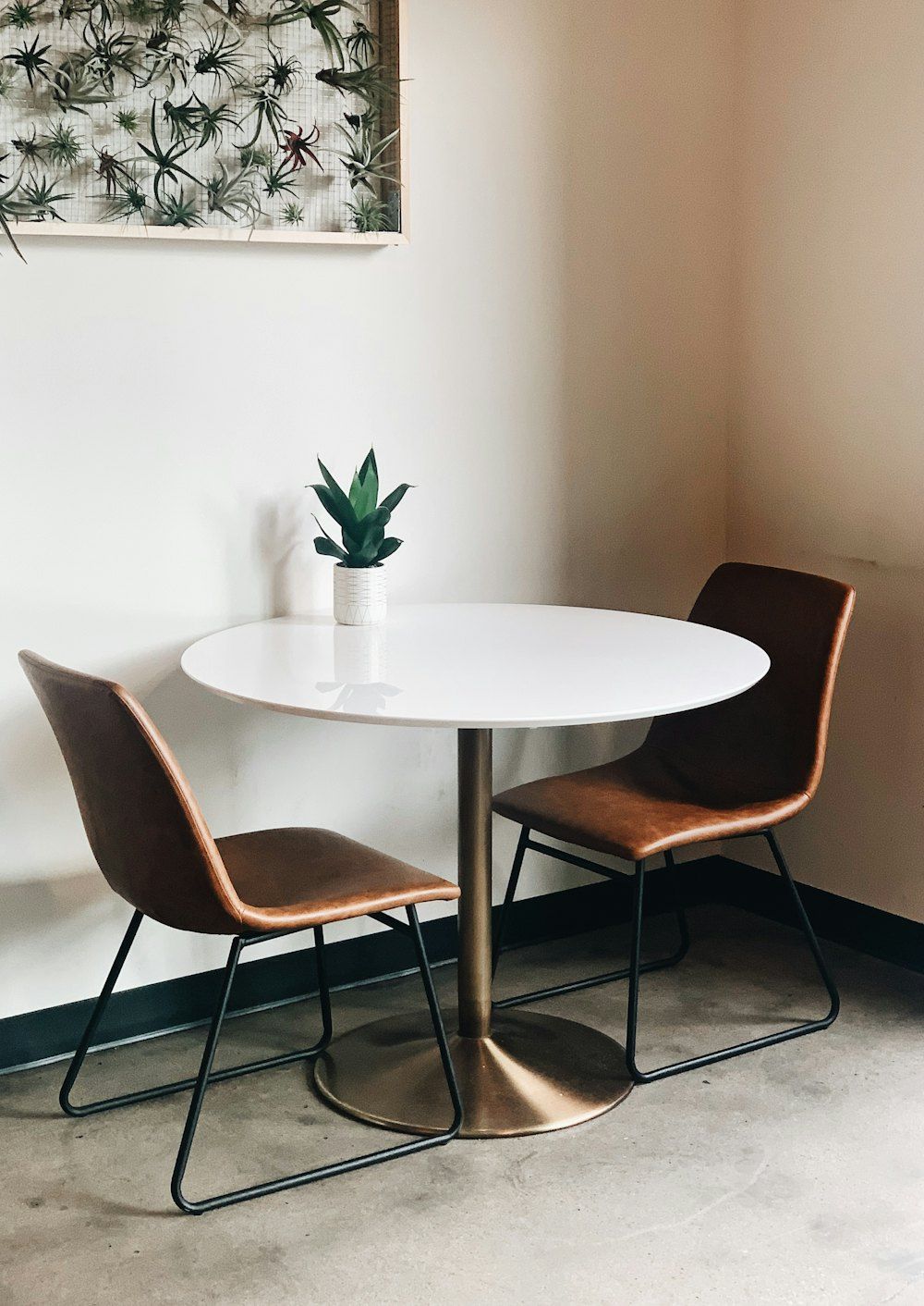 Oval white wooden table with chairs