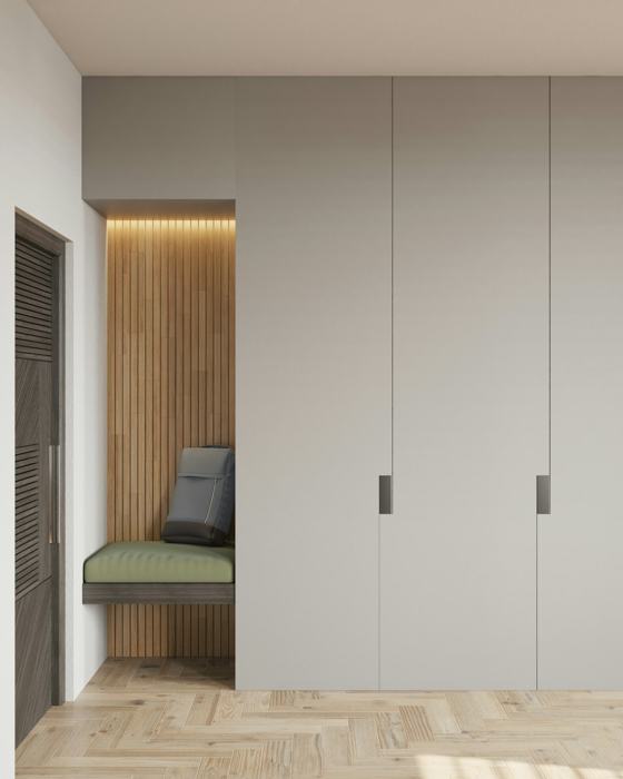 A room with a bench and some cupboards