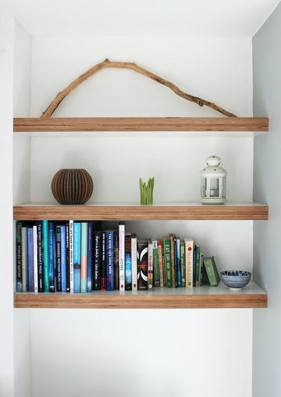 Books on brown wooden shelf