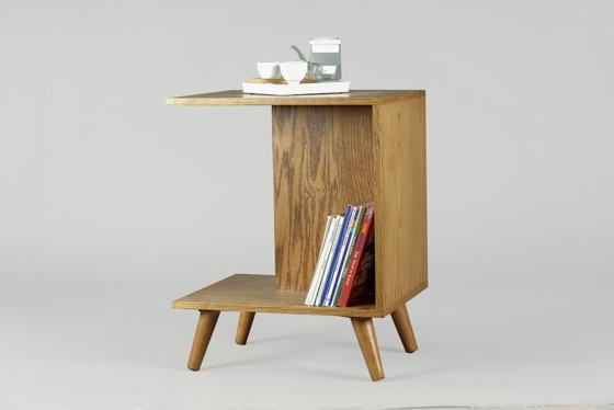 Brown wooden table with books and mugs