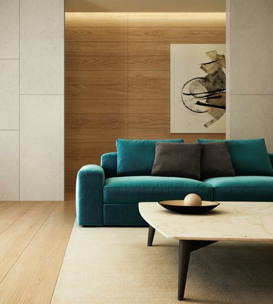 Blue sofa beside brown wooden table