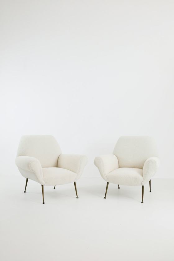 A couple of chairs sitting next to each other