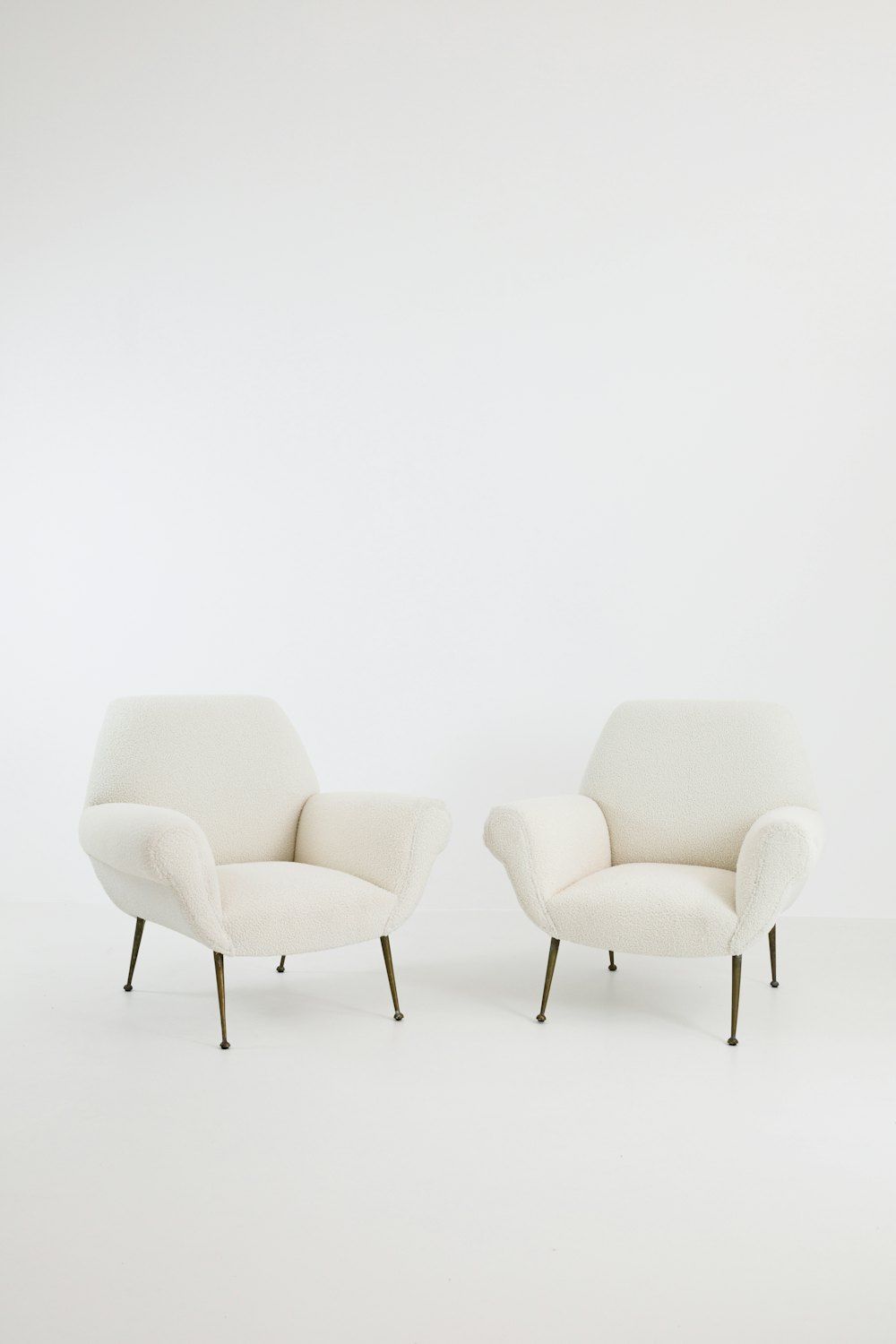 A couple of chairs sitting next to each other