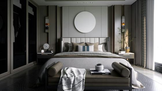 A bedroom with a large bed and a round mirror on the wall