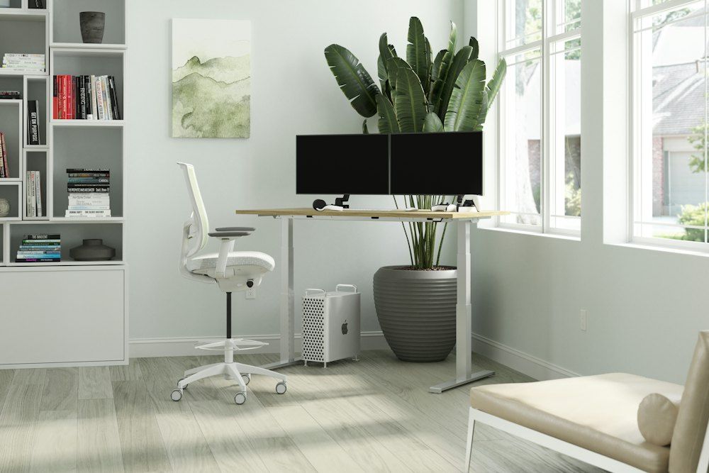 Black flat screen tv on white wooden table