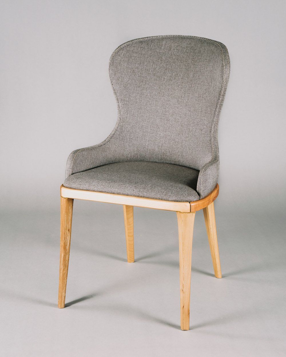 Gray and white padded chair